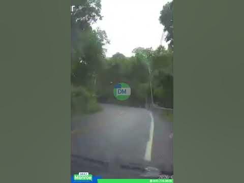 Car lost control on a rain-slick turn on Seven Springs Mountain Road, hitting another car.