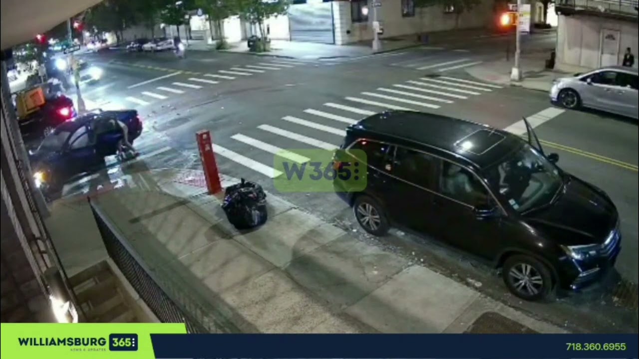 Moment a vehicle runs a red light, crashes into an oncoming vehicle, and flees the scene.
