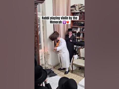 Kretchnif Rabbi playing violin by the Menorah 🕎❤️‍🔥