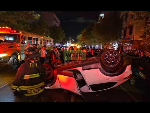 Vehicle suddenly pulled out from a double-parked position, causing a passing vehicle to overturn