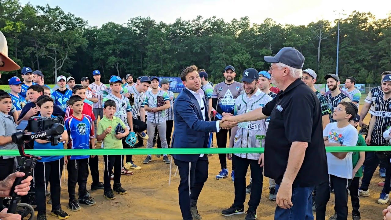 Mayor Ray Coles throws out the 1st Pitch at the Pease Bell Ribbon Cutting ceremony by LBA League's.