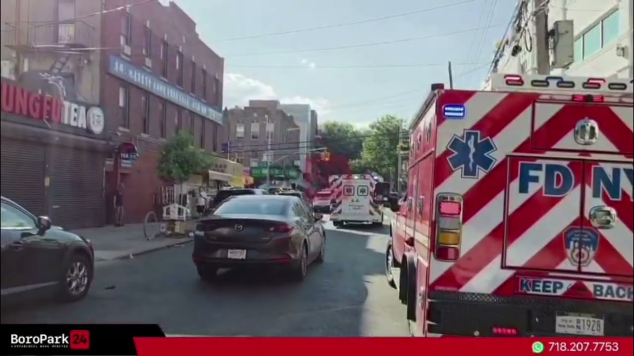 Woman critically injured after falling from third-floor porch, entangled in utility wires.