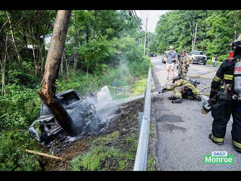 A vehicle rolled over, struck a utility pole, and caught fire on Route 208 near Stonegate Drive.