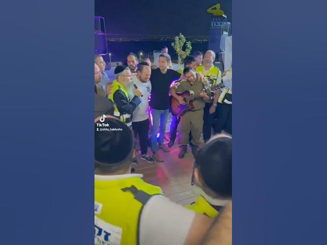 Avraham Fried singing with ZAKA volunteers