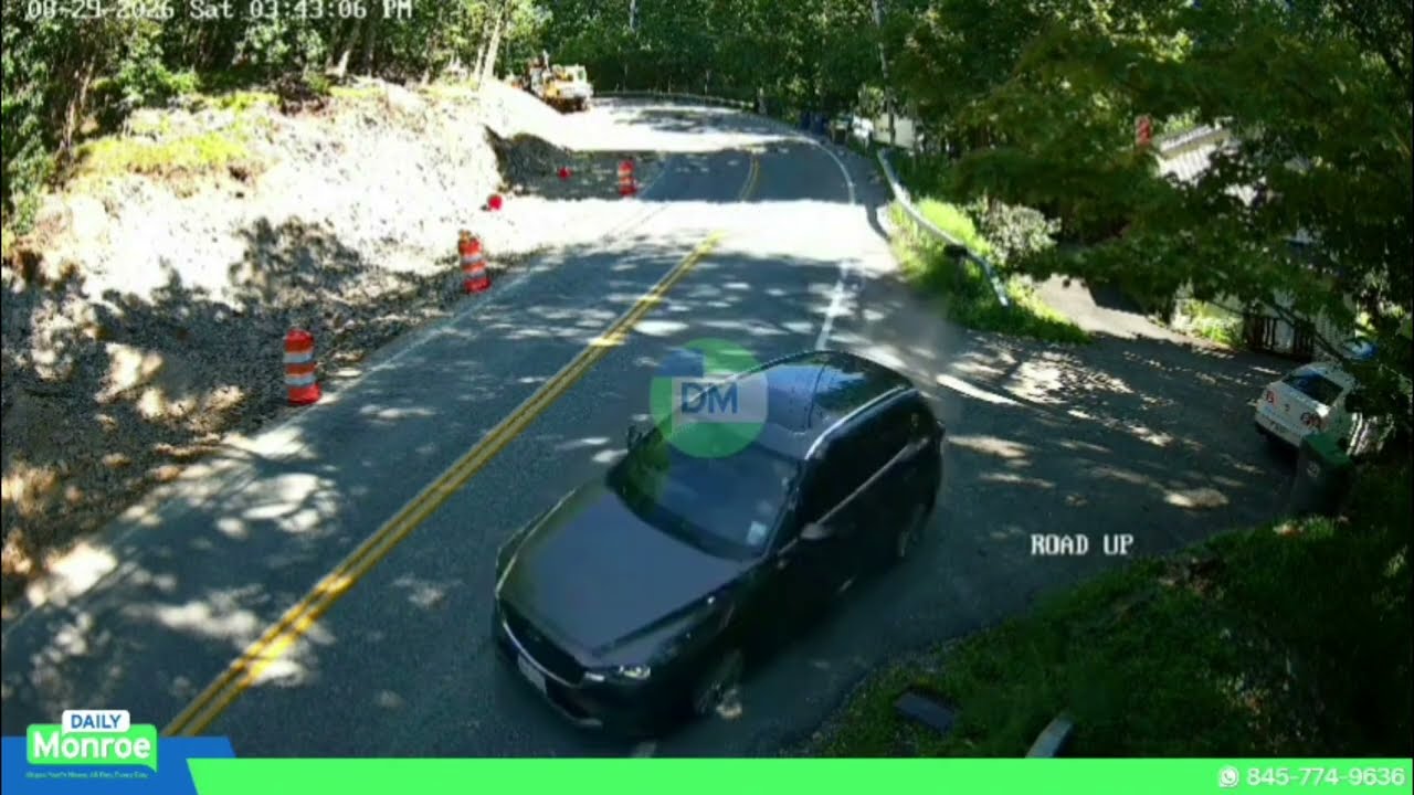 Car loses control on sharp curve, slams into guardrail, nearly hitting two pedestrians.
