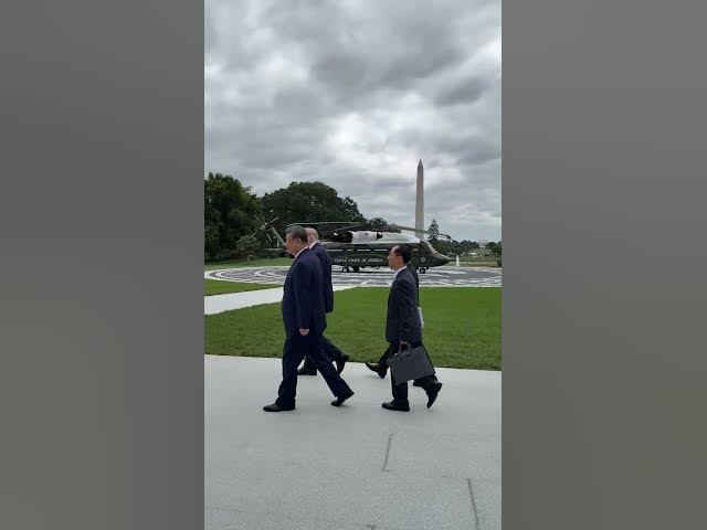 President Trump walks outside to give Chinese President Xi a tour of the new White House helipad