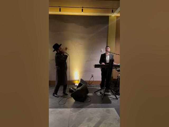 Yidi Bialastozky with Dovid Ungarischer