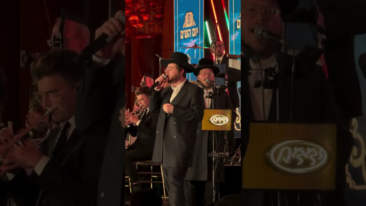 Hershy Weinberger and Meilech Braunstein singing at the Yom Hashas event