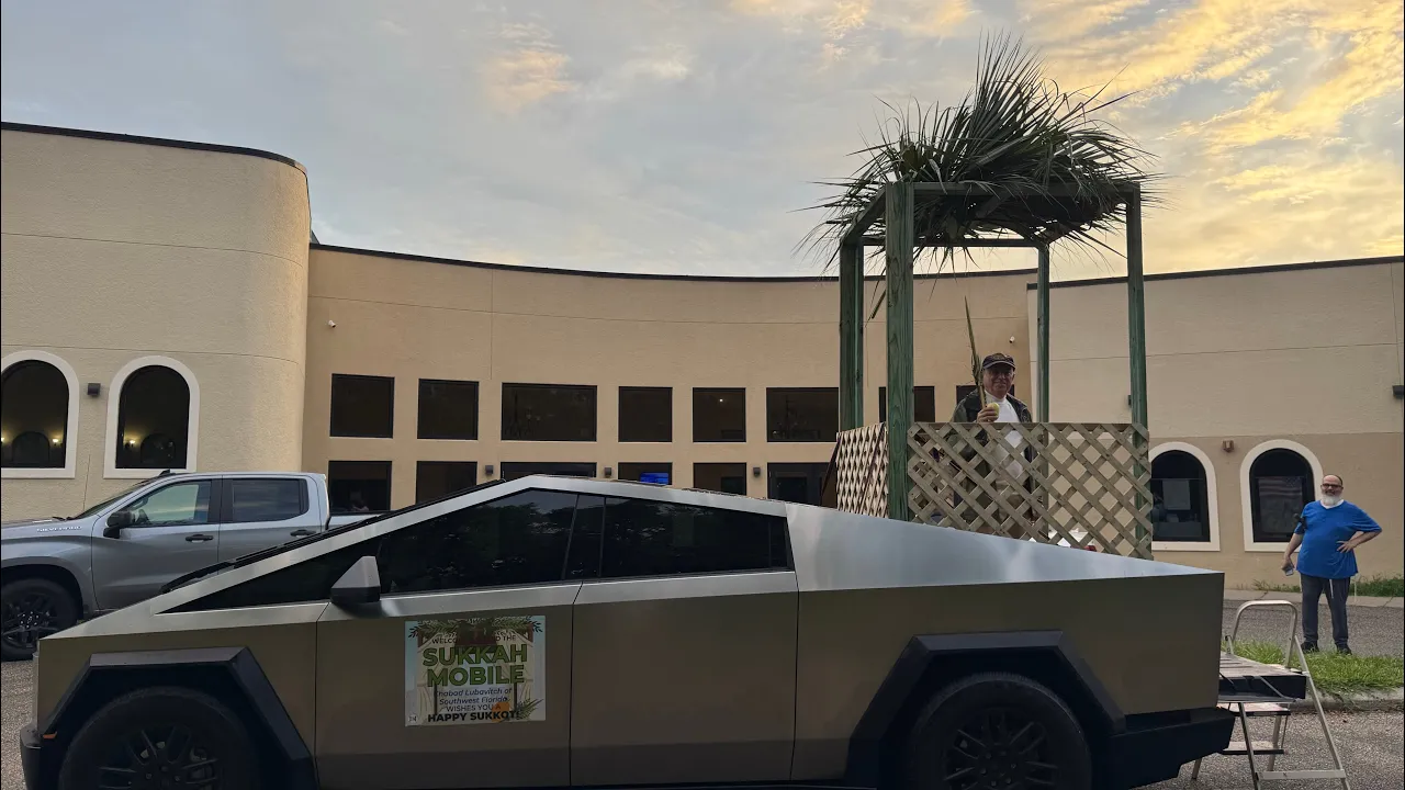 A Kohen lulav blessing sukkah Tesla Cybertruck Happy Sukkot Rabbi Yitzchok & Shani Minkowicz