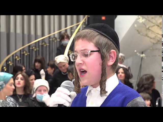 Child Soloist Sings Báld Báld Accompanied by the Shira Choir