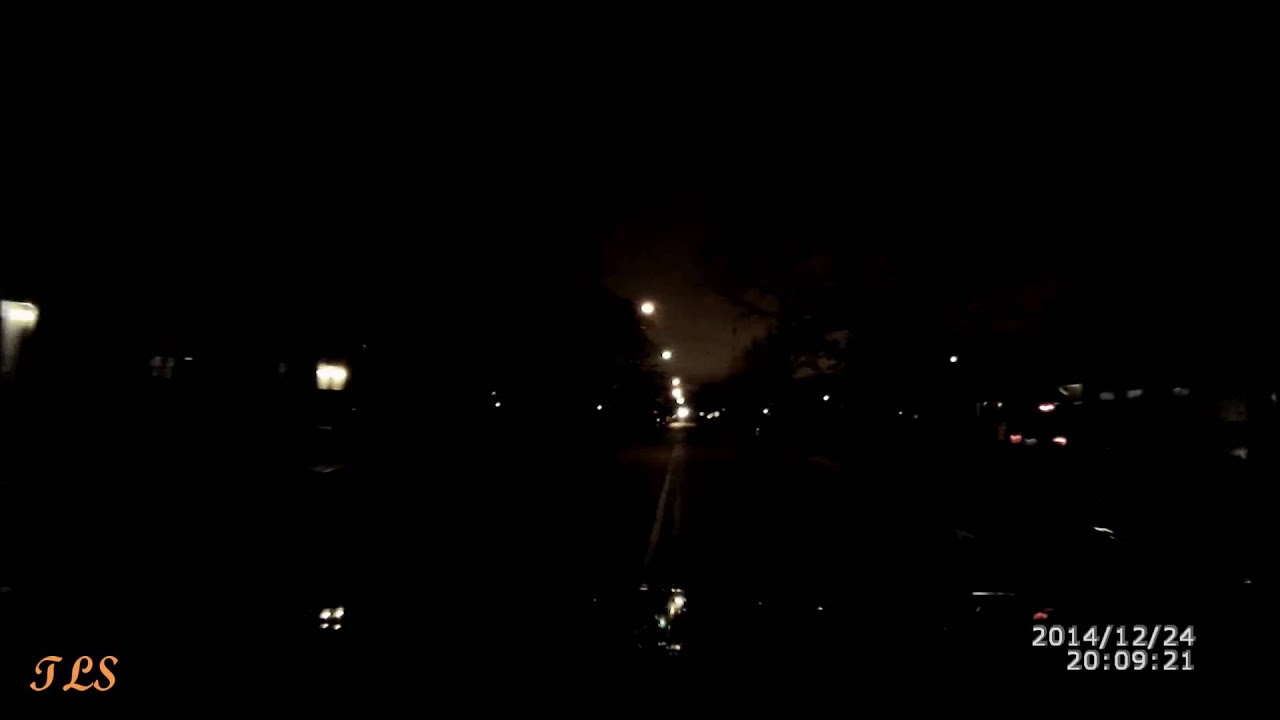 Pedestrians dressed all black crossing at night