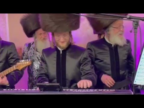 Two Rabbis Dancing On Music Stage For The Chusen Who Took The Keyboard At His Wedding
