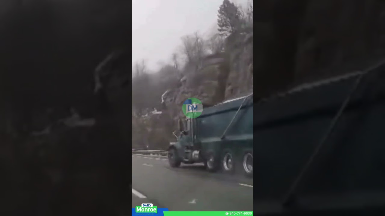 Watch: A salt truck veers off the roadway and overturns on the Thruway.