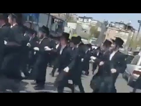 Buchirim Running After The Car Of Viznitzer Rabba Shlita who's On His Way to Vienna For Vacation