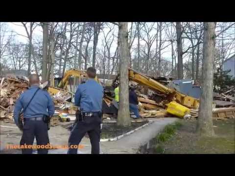 Overturned Excavator into Basement
