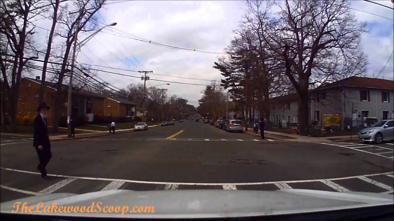 Driver cuts off vehicle waiting for pedestrian to cross