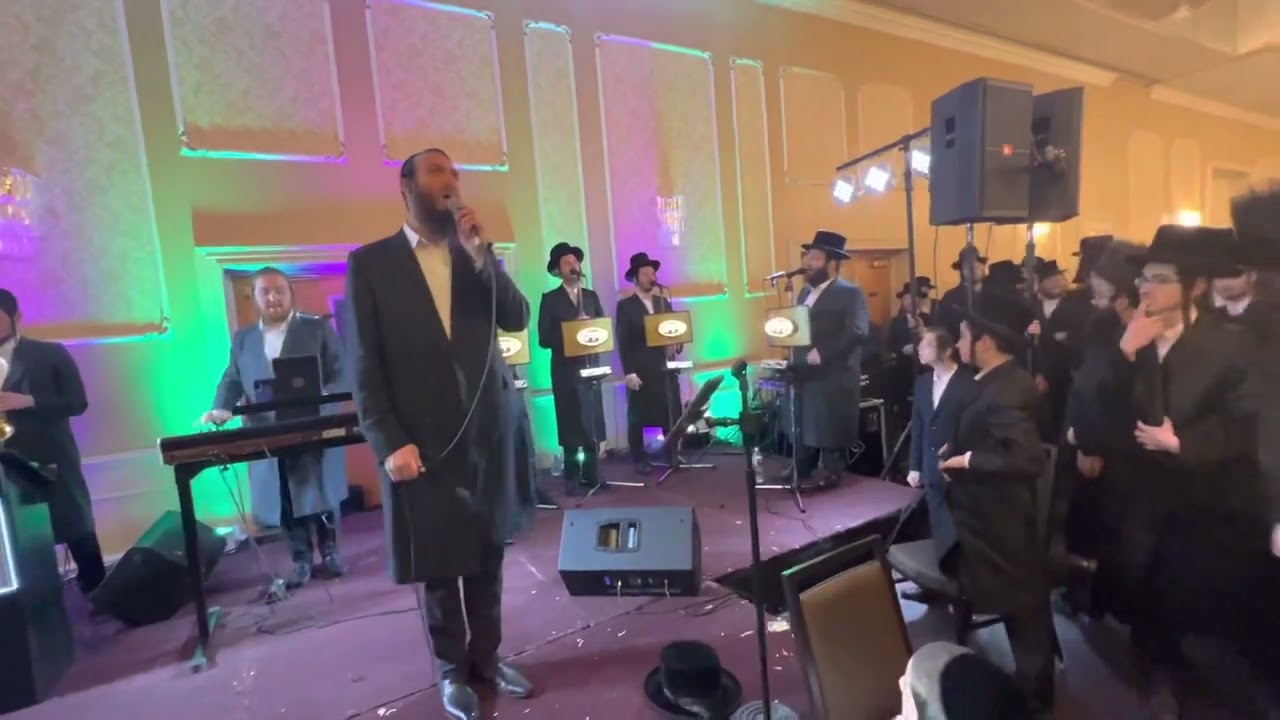 Beri waber singer Avrum david lunger on keys with Yedidim choir