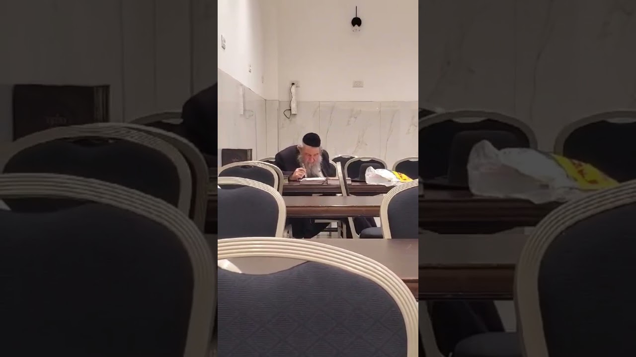 Rabbi Menachem Eichenstein Shlit"a - Rosh Yeshiva Dvar Torah Jerusalem - learning during a break.