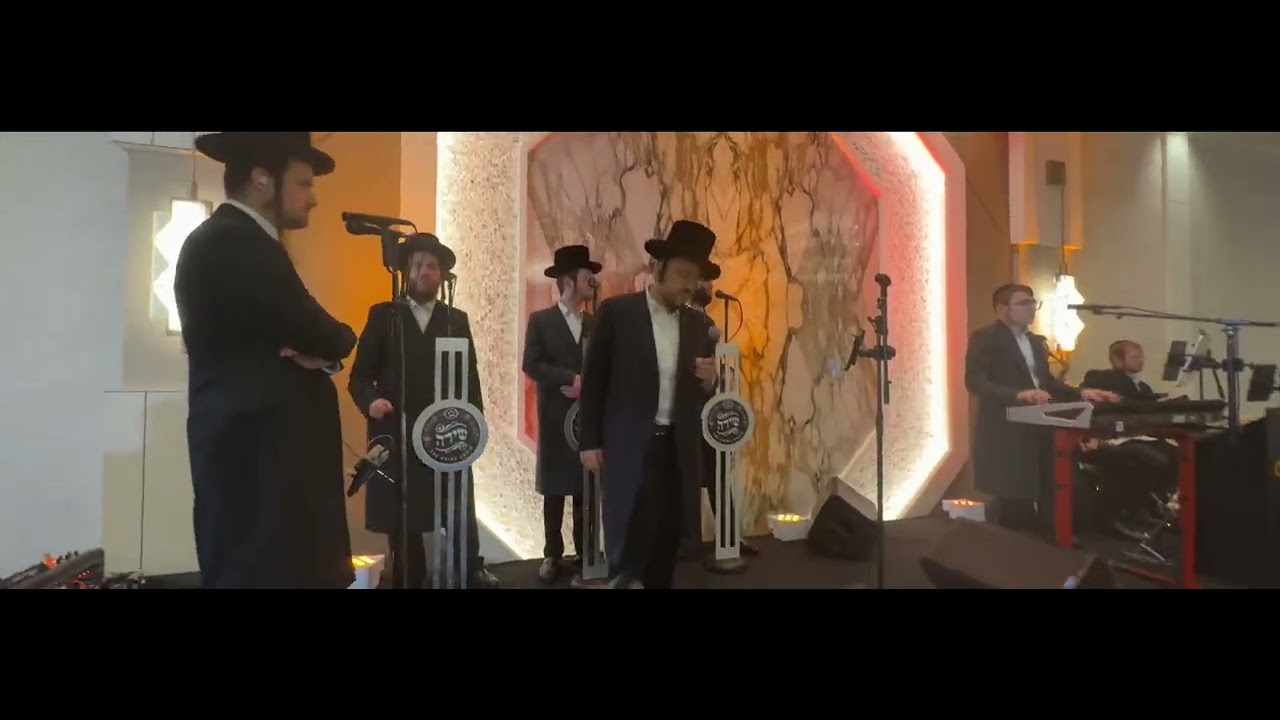 Chesky Schwartz on keys & Lipa Schmelzer & Shira Choir
