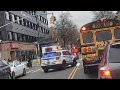 NYPD Officer Passing School Bus While Lights Are Fleshing