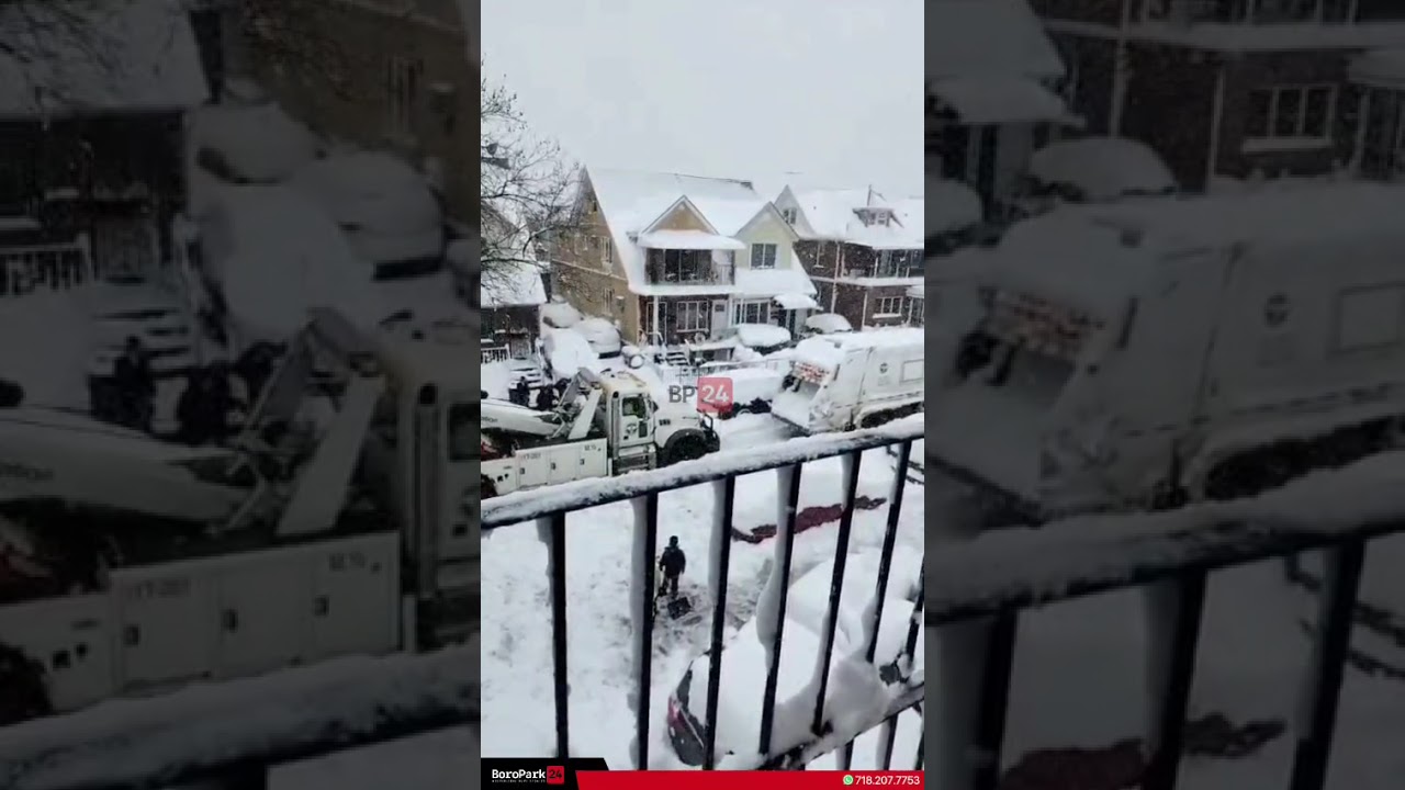 A garbage truck got stuck in the snow on 59th Street, with a DSNY two truck assisting at the scene.