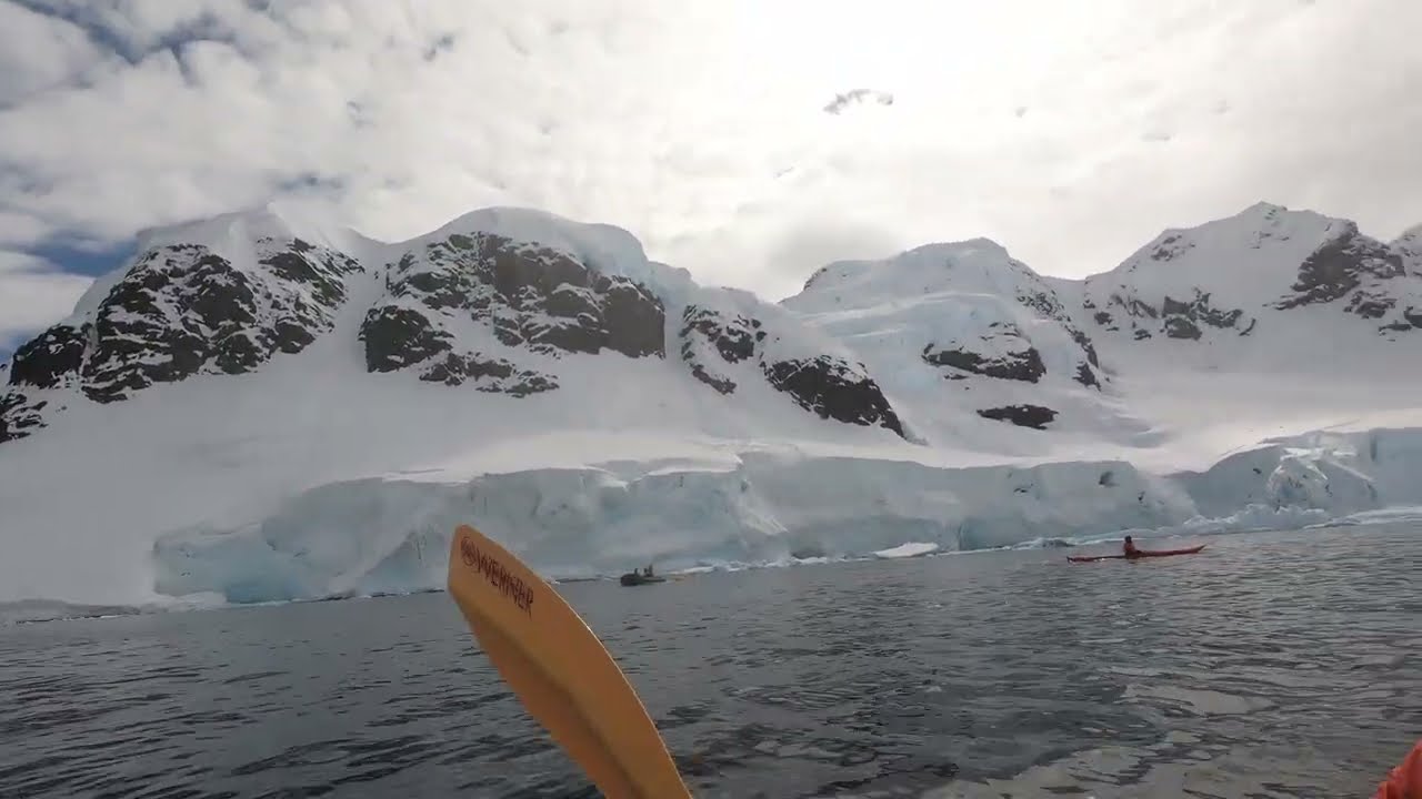 Ice calving while kayaking in Antarctica