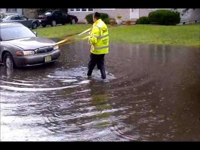 Chaveirim Pulling Car out of Flooded Street
