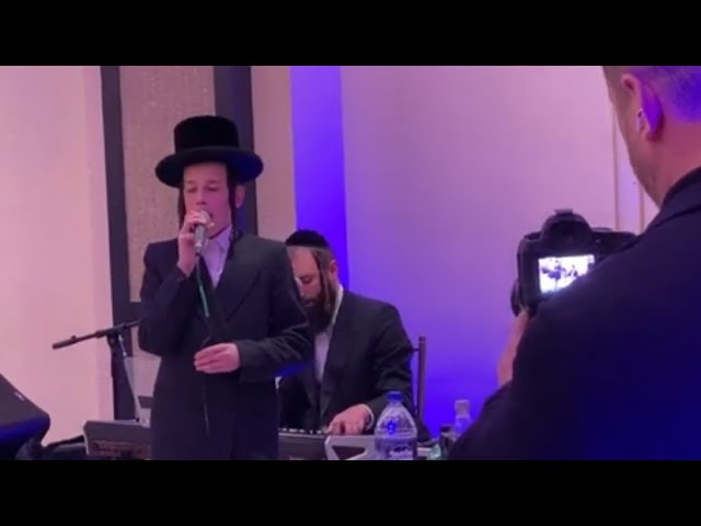 Former Child Soloist Dovi Barchoirin Singing With Shira Choir At A recent Event