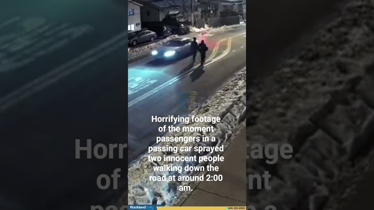 Moment passengers in a passing car sprayed two innocent people walking down the road at 2:00 am