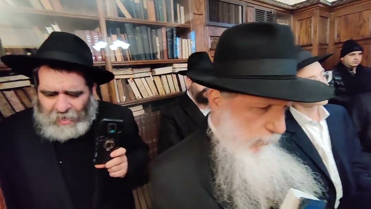Rabbi Shea Hecht Lights Second Chanukah Candle in Rebbe's Room
