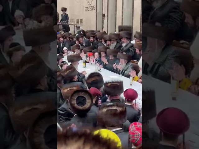 Bobov Rebbe Lighting A Pipe During The Purim Tish 5783