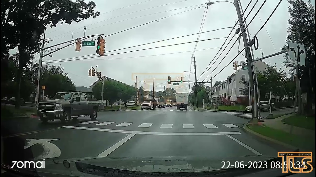 Truck passes school bus with flashing lights
