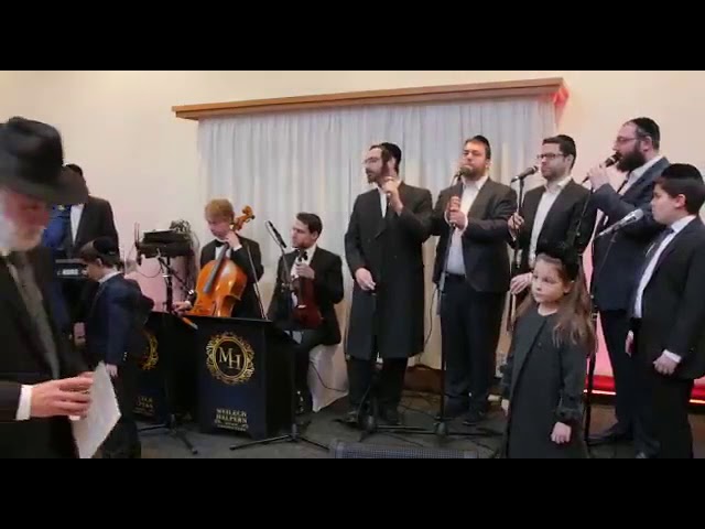 Buchi Glick and choir perform Im Eshkachech with Meilech Halpern at a recent Chupa