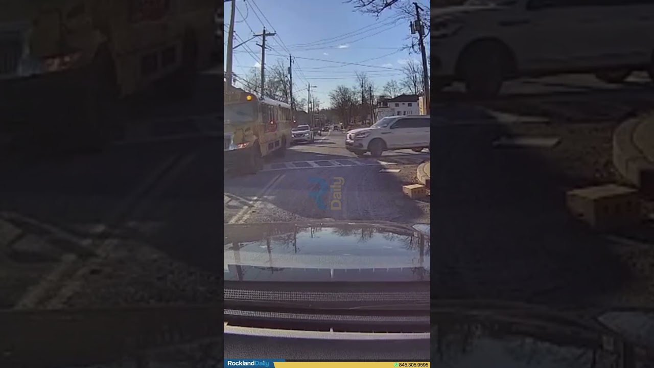 Impatient Driver Passes A School bus, While Dropping Off Children With The Red Lights Flashing