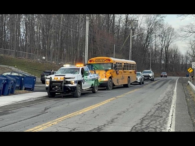 Bus stuck on Seven Springs Mountain Road. Chaverim moved it aside; tow truck removed it.