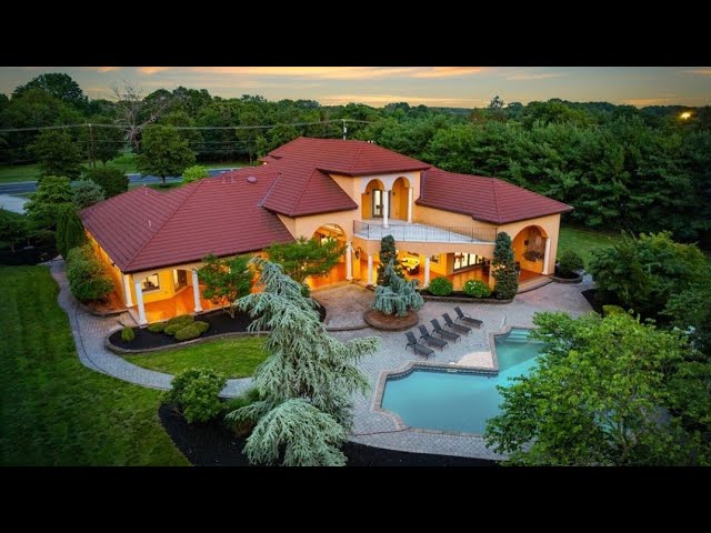 Tour this breathtaking Mediterranean-style home in Toms River! beautiful architecture & surroundings