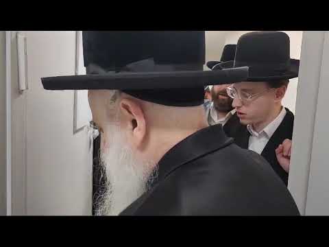 Botoshan Rebbe Putting Up A mezuzah at the house of one of his chassidim - Iyar 5785