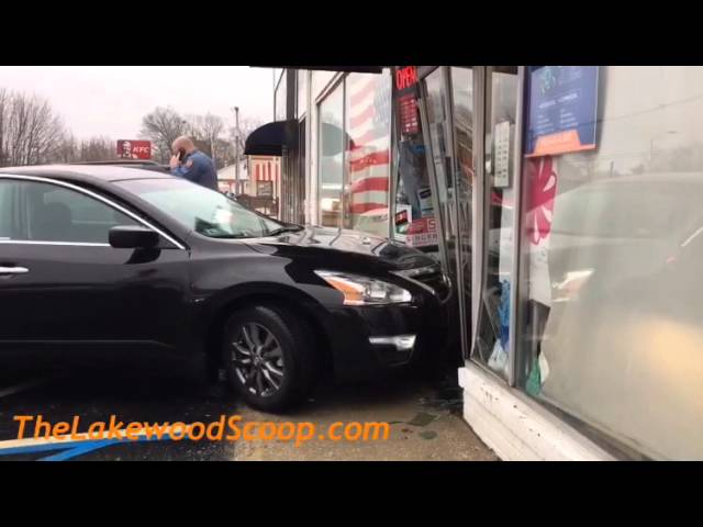 Car crashes into storefront in Lakewood