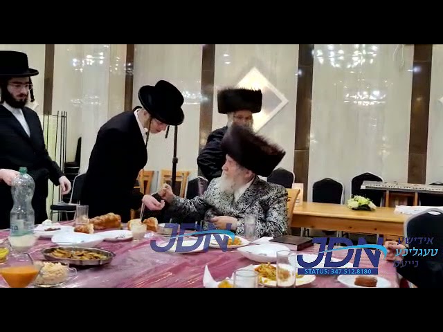 Temeshvar Rebbe Giving Out Chanukah Gelt in Diniv First Night Chanukah 5782