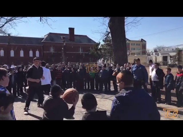 Lakewood police officers play basketball with some Lakewood boys