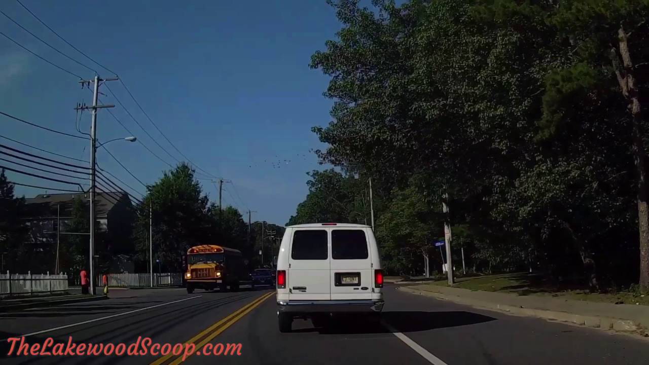 Vehicle passes school bus with red lights on Squankum Rd