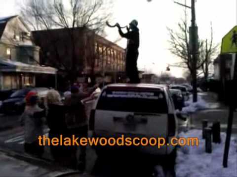 Purim in Boro Park Blowing Big Shofar On Van