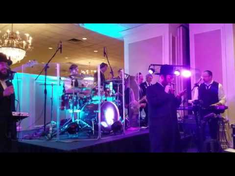 Crazy energy by Yisoscher Guttman and Shira choir with symphony band. You must watch it