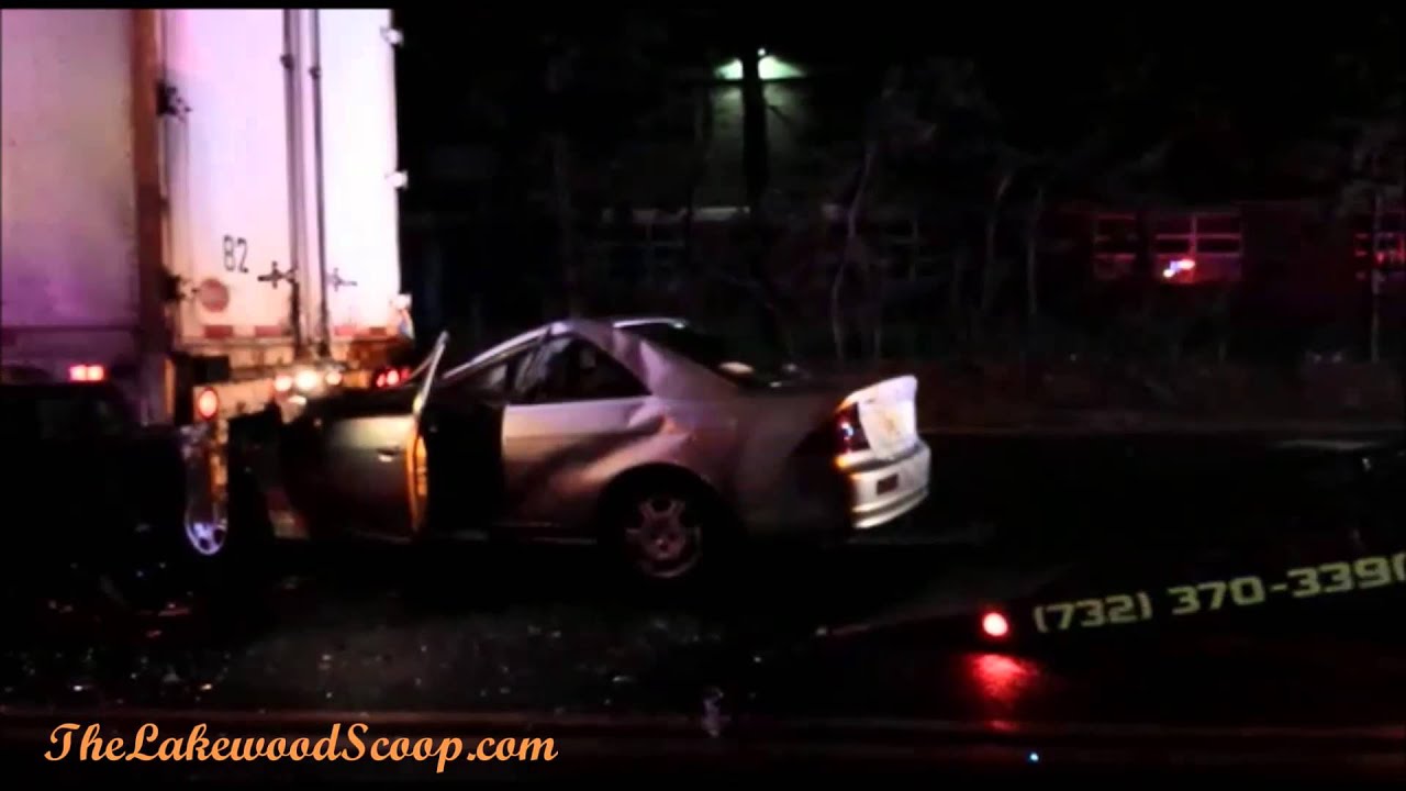 Vehicle Pinned Under Truck Lakewood