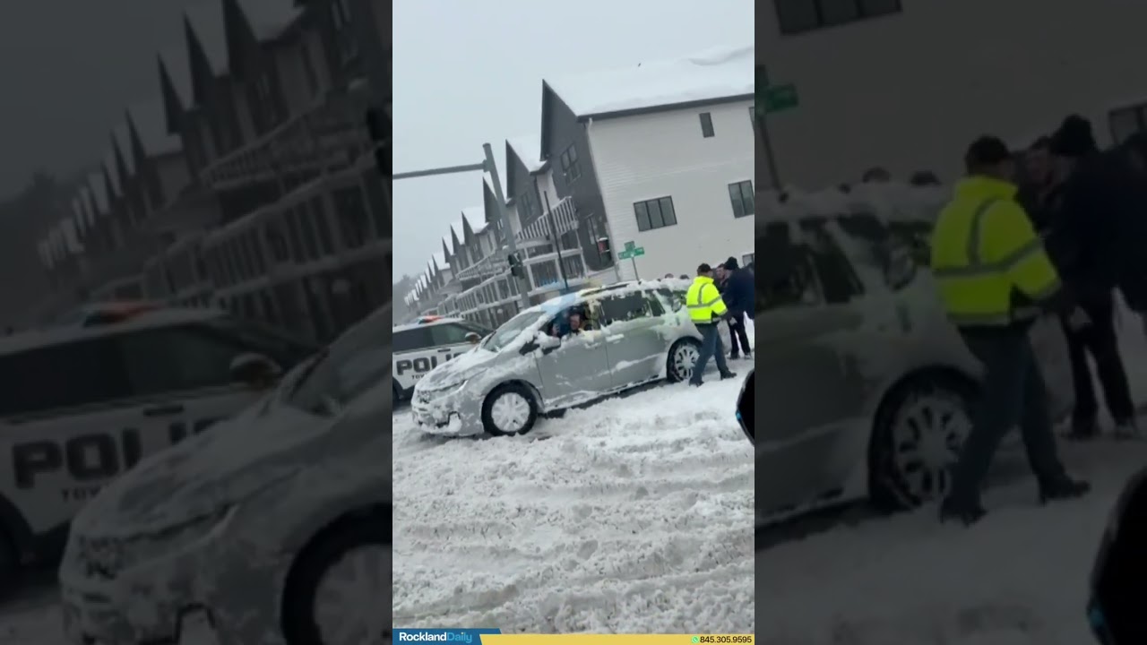 Local officials seen assisting a motorist stuck on Kearsing Parkway and Route 306 during the storm.