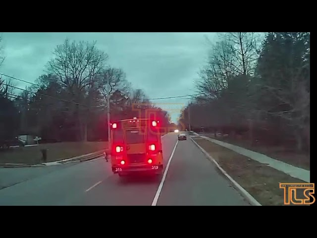 Car passes school bus as child gets off