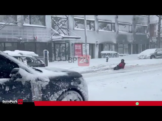 The fun begins! A car was spotted pulling a sled with a rider along 16th Avenue and 45th Street