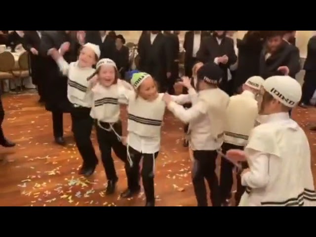 Group Of Kids Dressed As Breslov Chasidim, In a very happy dance at a wedding