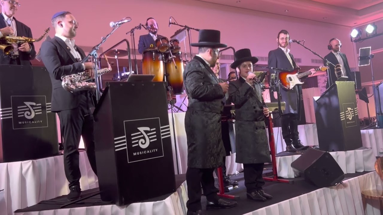 Lipa Schmeltzer singing with his son Shimmy, at his Bar Mitzvah.