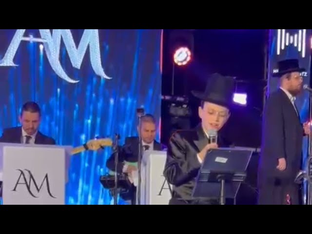 An Emotional Child Soloist Meir Rosinger, Performing At His Bar Mitzvah With Shira Choir